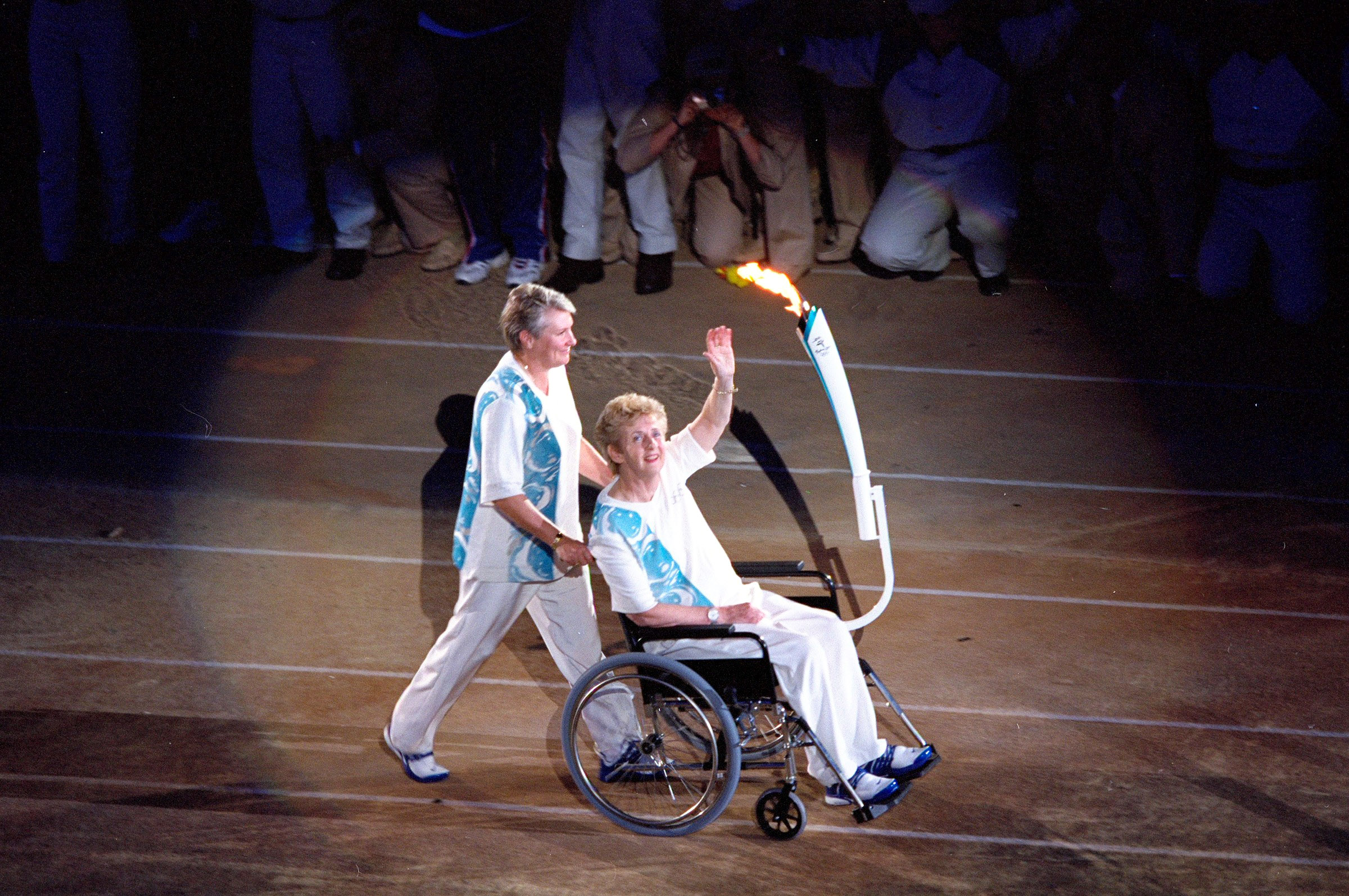 Betty Cuthbert pushes by Raelene Boyle